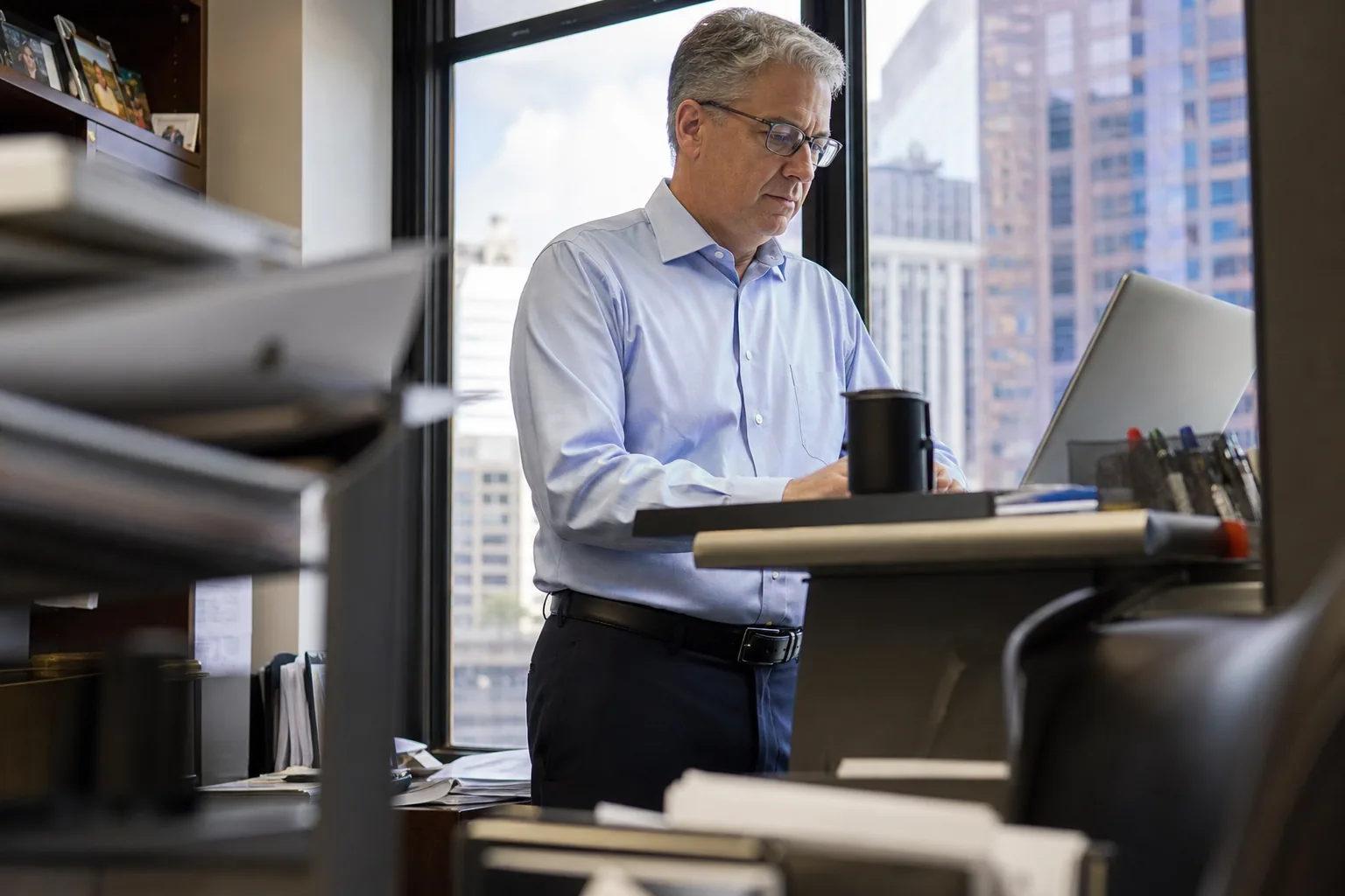 Firm owner reviewing client records at the end of the month